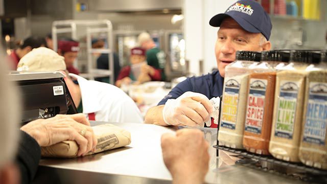 Customers at the sprouts meat counter