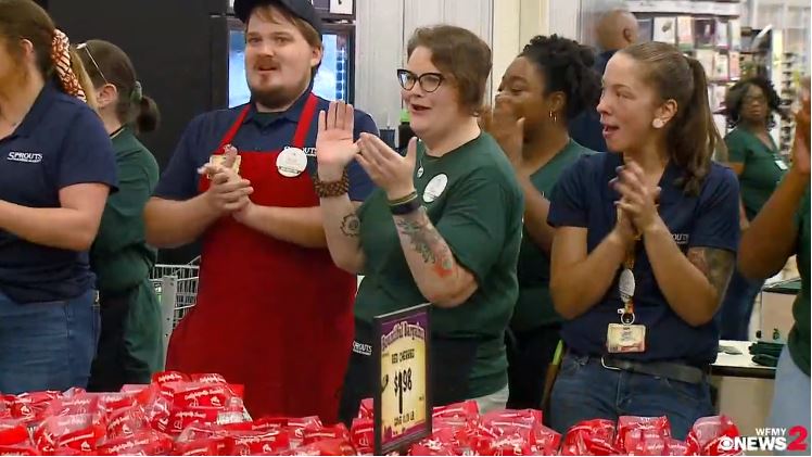 TV broadcast of store team members clapping at the Sprouts grand opening in Greensboro, North Carolina