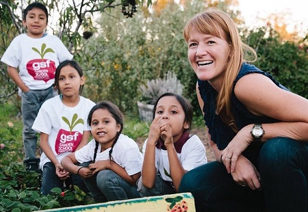 About Our Partners 450x310 kids kneeling in garden with teacher