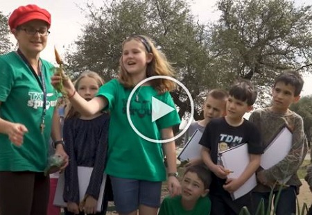 Foundation Video 450x310 Video Still of Kids in Garden with teacher