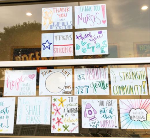 inspirational drawings and quotes posted on the store window