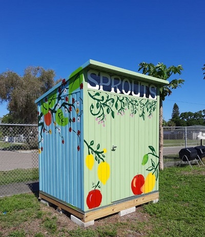 A brightly painted shed in a school garden