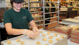 Sprouts Bakery associate preparing cookies