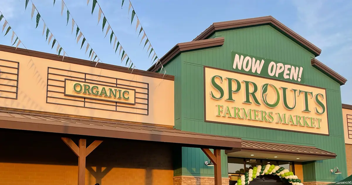 Sprouts store exterior with now open sign