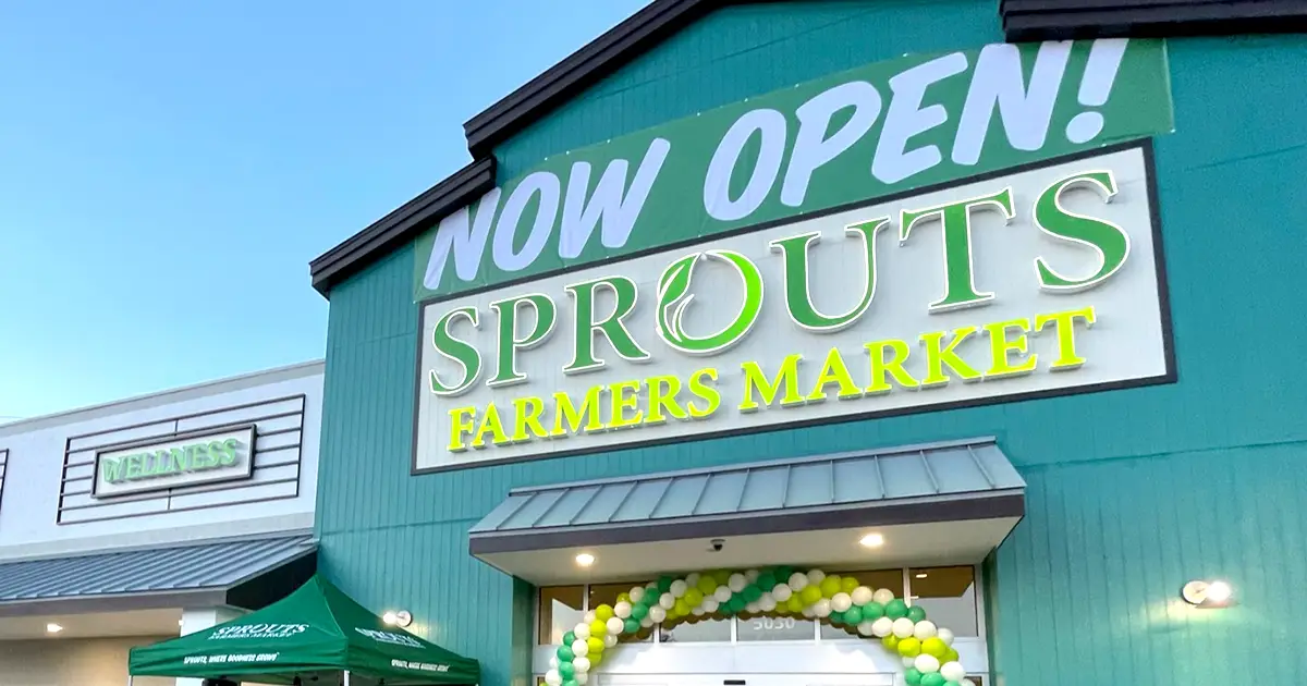 Sprouts store exterior with now open sign