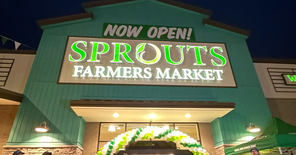 Sprouts store exterior with now open sign