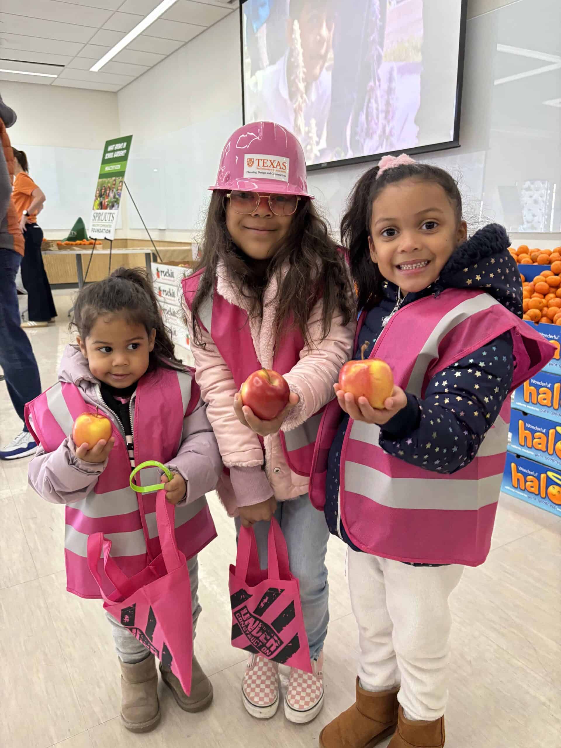 Kids holding apples